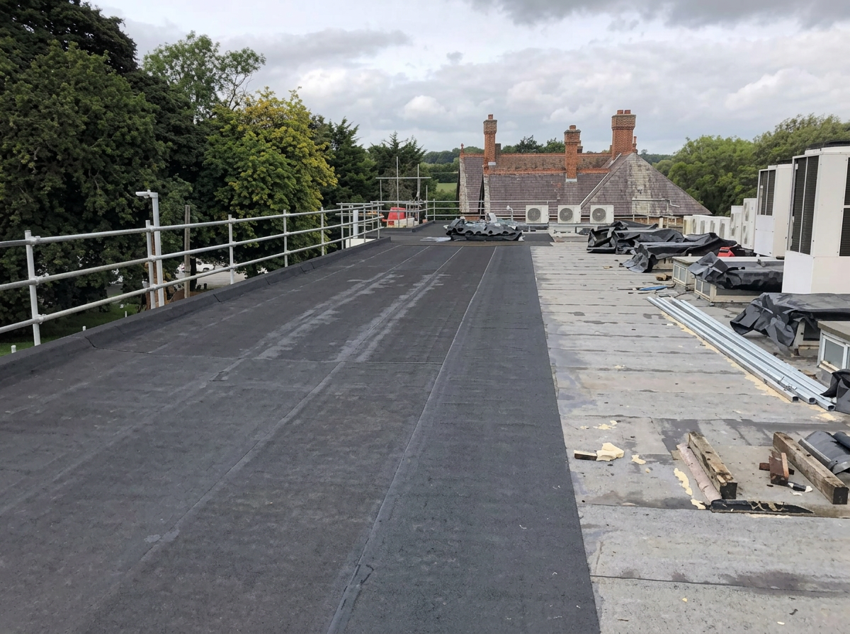 Commercial flat roof covering laid across a large deck