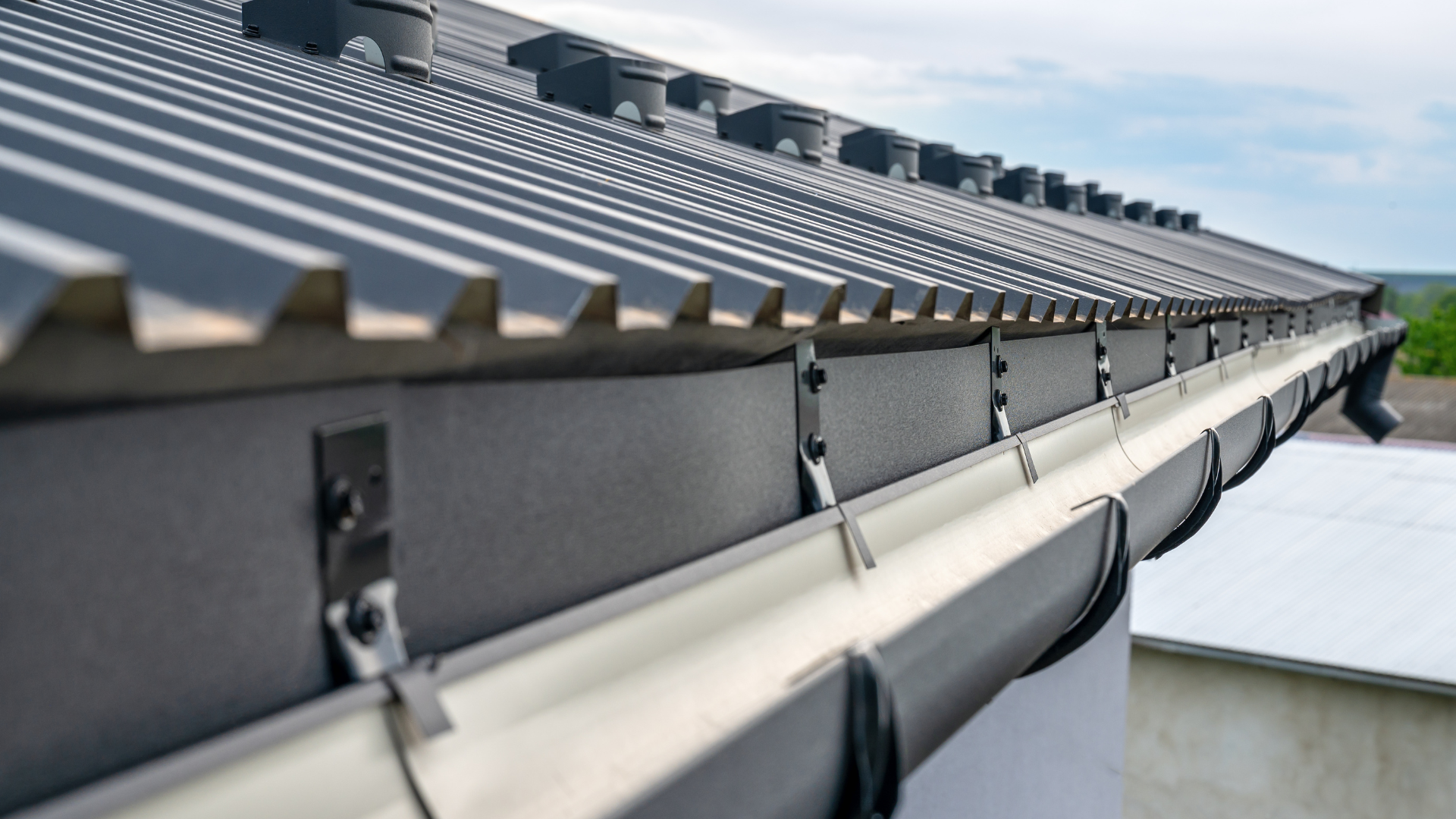 New guttering run fitted along the eaves on correctly spaced brackets